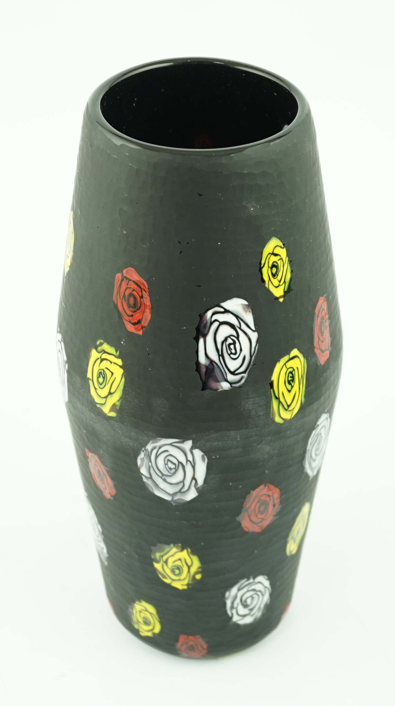 Vittorio Ferro (1932-2012) A Murano glass Murrine vase, the black ground with white, red and yellow flower heads, unsigned, 28cm., Please note this lot attracts an additional import tax of 20% on the hammer price